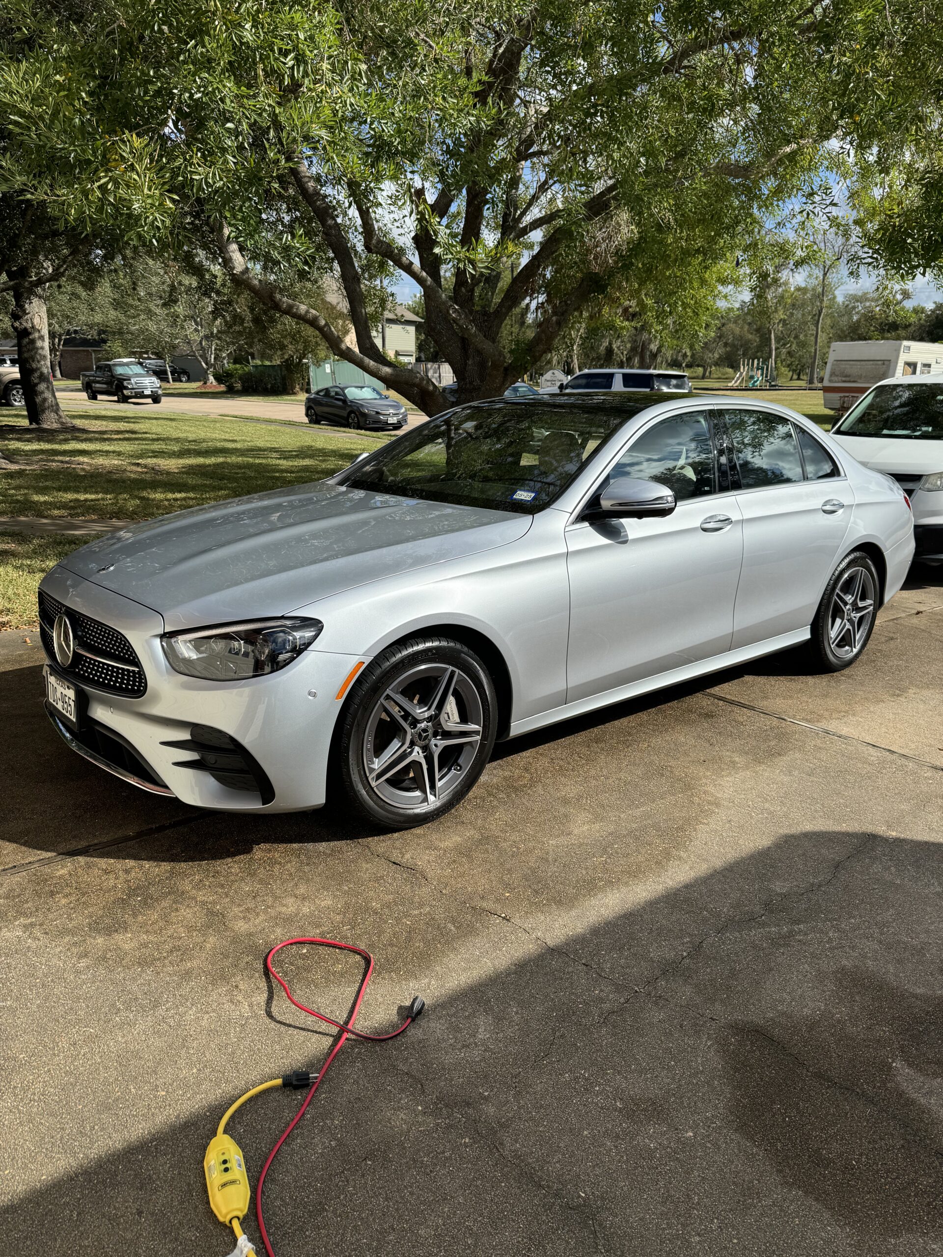 The image features a Mercedes E-Class parked in a driveway-D.W Automotive Details